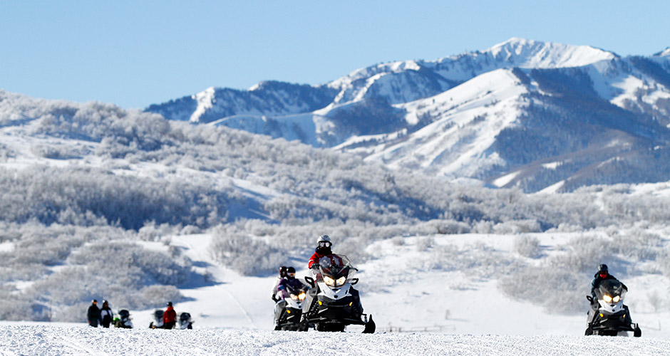 Snowmobiling and taking in the view at Deer Valley. Photo: Alterra Mountain Company