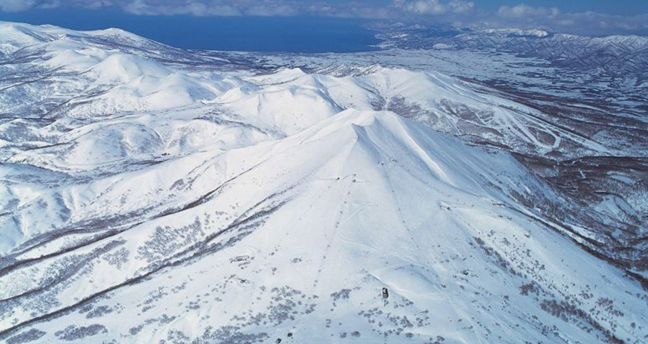 Niseko Annupuri Mountain with the Sea of Japan in the background. Photo: Niseko Tourism Board