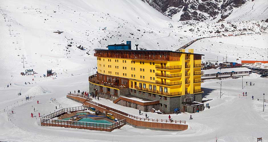 The yellow facade of the main hotel is iconic. Photo: Portillo Ski Resort.